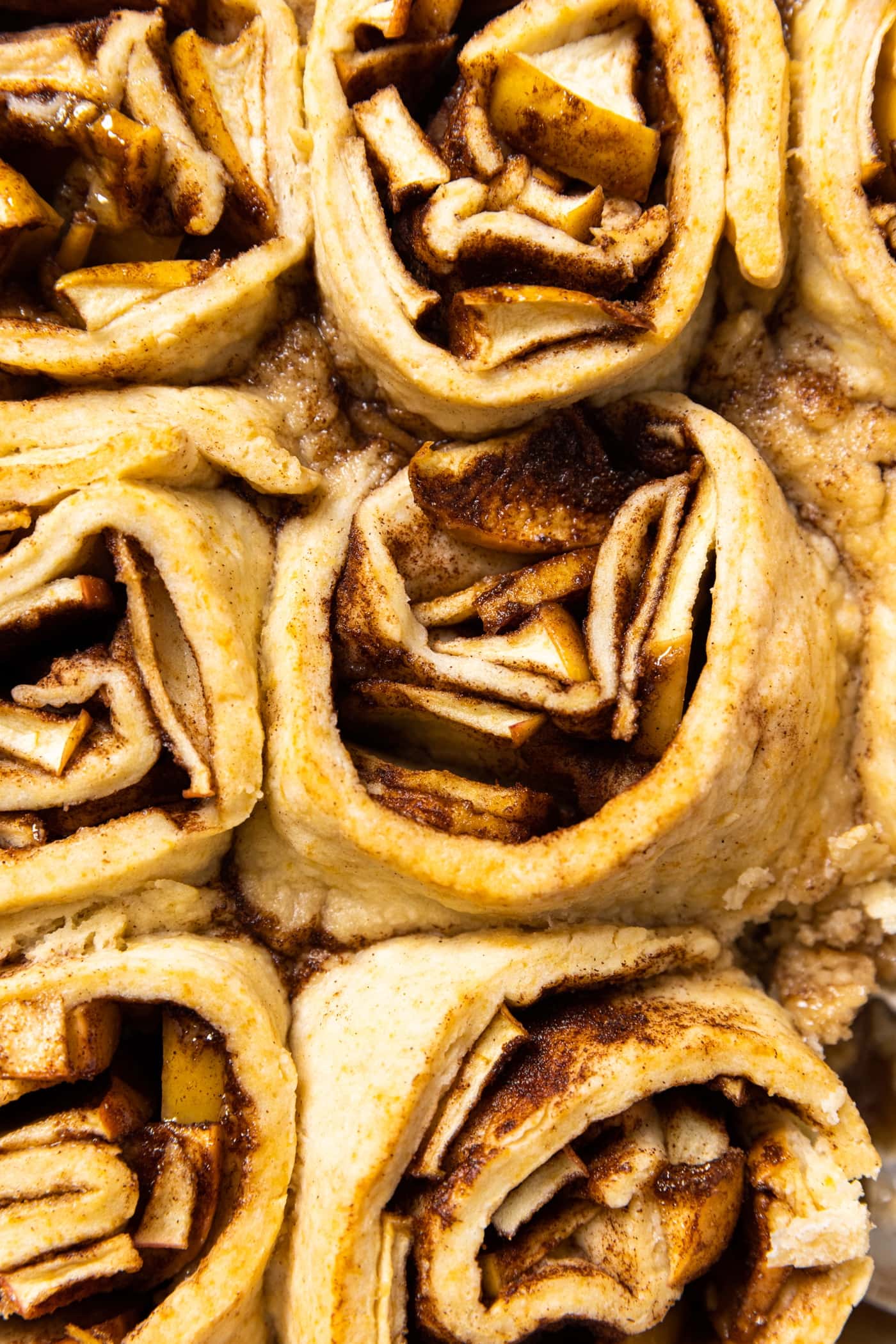 Top down view of intricate rolls of apple dumplings after being baked in the oven