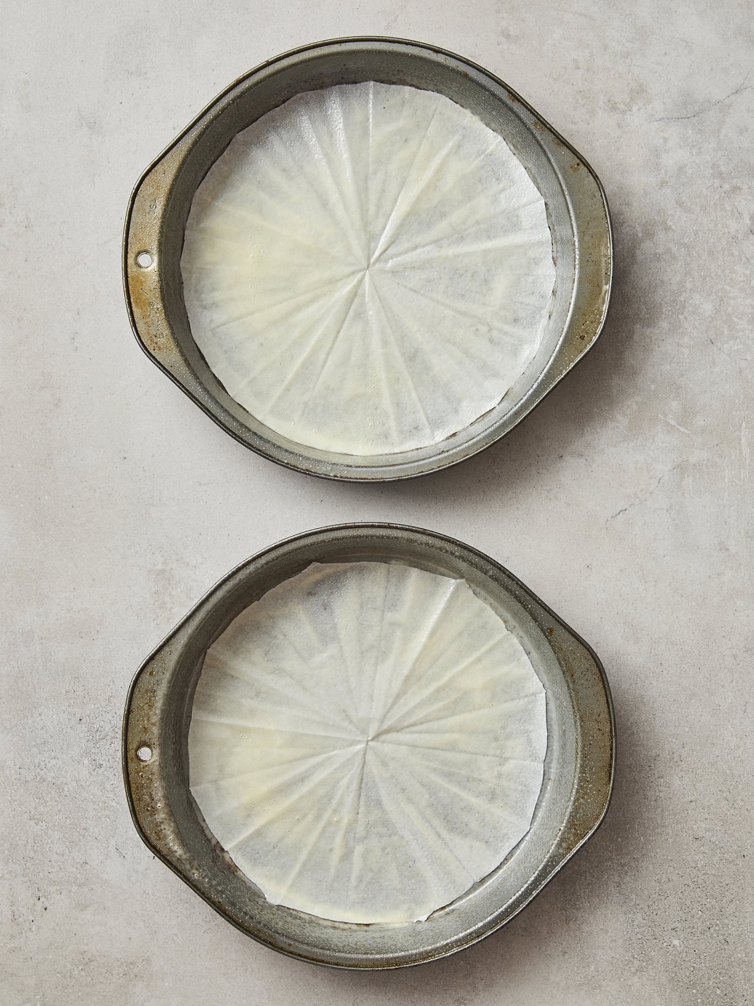 Two cake pans greased.