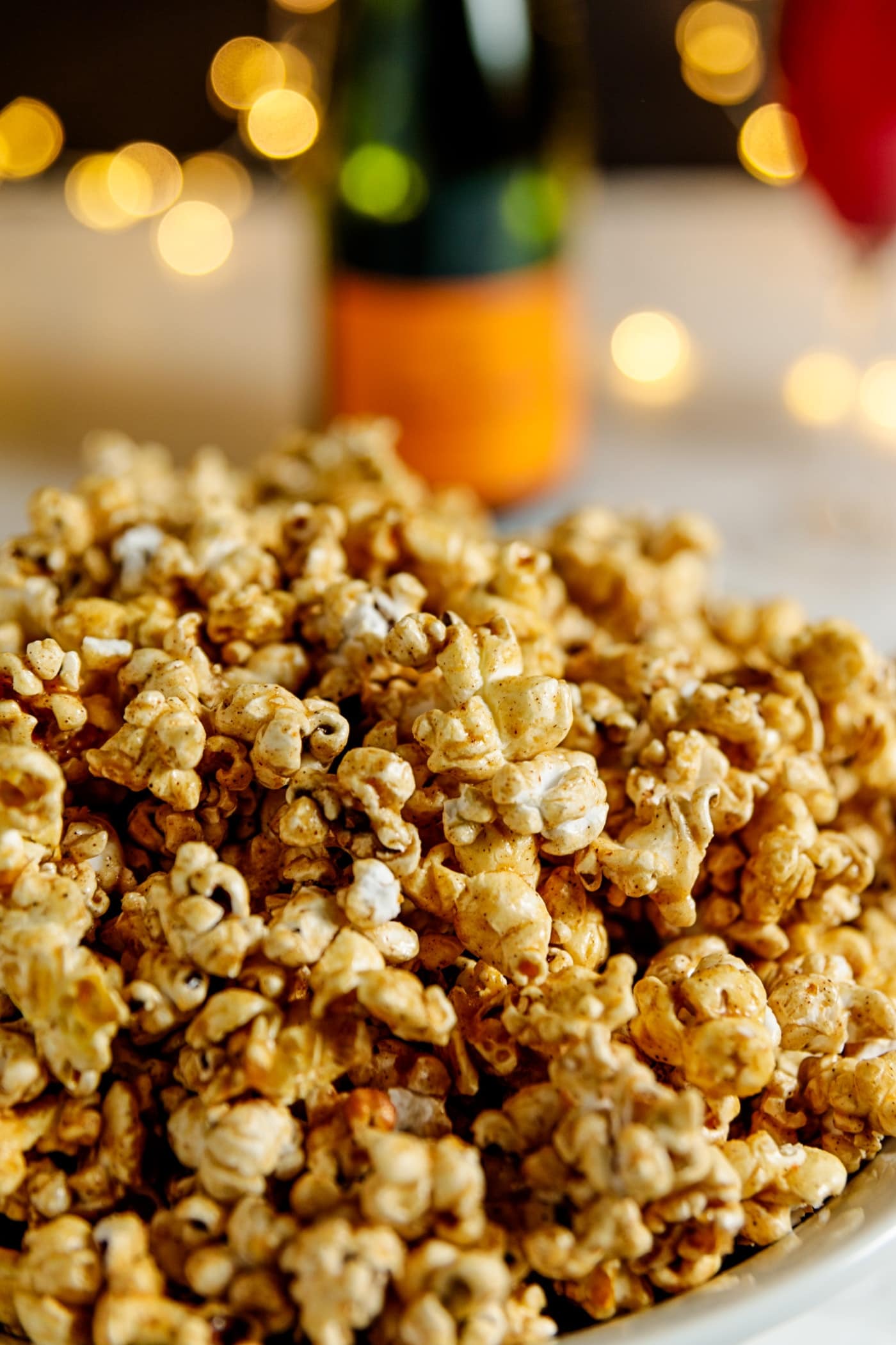 Caramel corn is the perfect light snack for any party. But when you elevate it with the flavors of cinnamon (for sweetness) and cayenne (for a bit of kick), it's that much better! | wyseguide.com #popcorn #caramelcorn #cayenne #cinnamon #NewYears