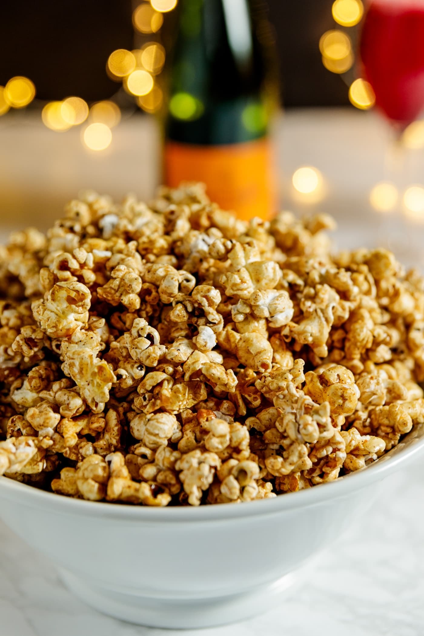 Caramel corn is the perfect light snack for any party. But when you elevate it with the flavors of cinnamon (for sweetness) and cayenne (for a bit of kick), it's that much better! | wyseguide.com #popcorn #caramelcorn #cayenne #cinnamon #NewYears