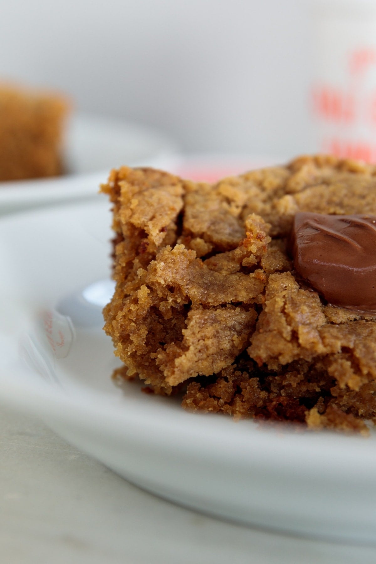 Texture of cake with chocolate candy on top melting showing gooey goodness.