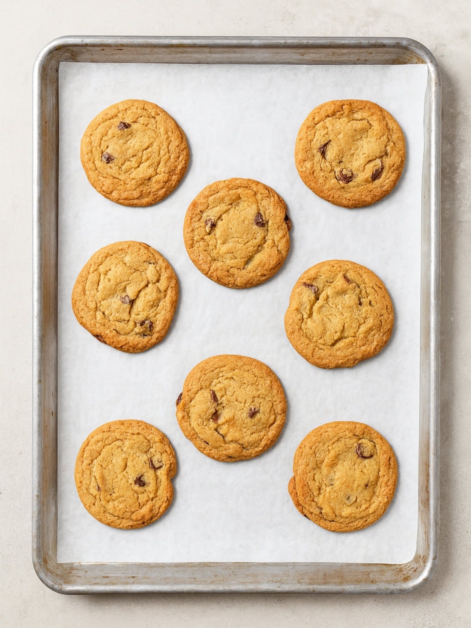 Pan of baked chocolate chip cookies.