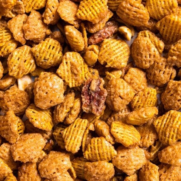 Top down view of sweet glazed party mix sitting on sheet pan