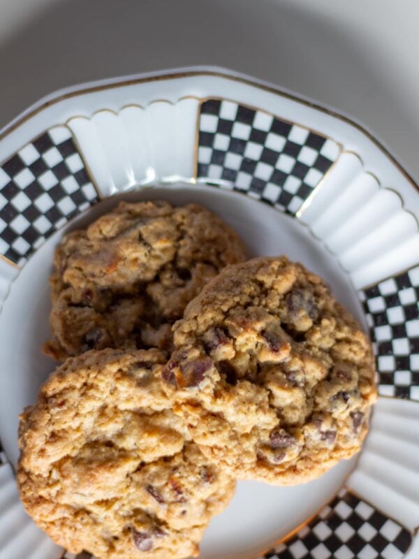 Three cookies overlap on a plate.
