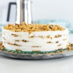 A cookie cake sits on a table.
