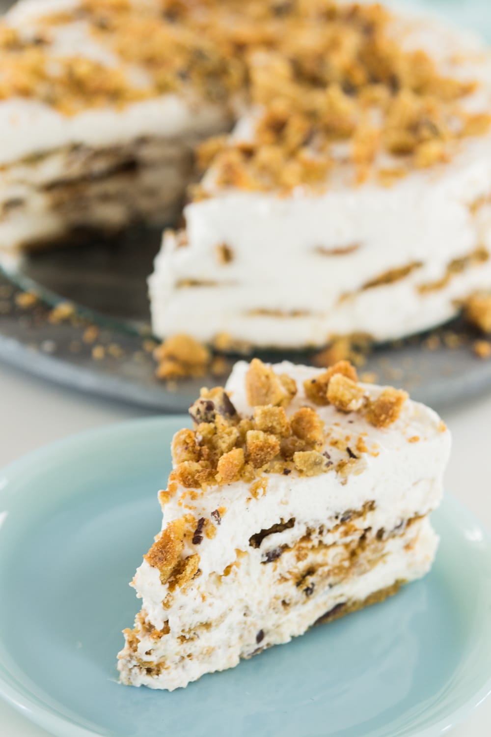A slice of cookie cake rests on a plate.