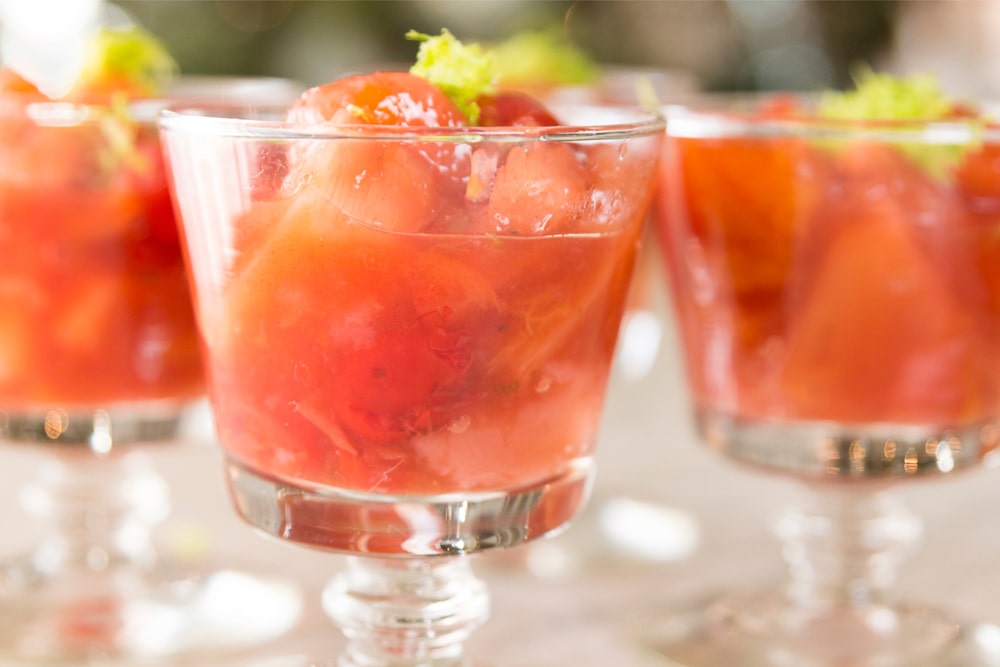 Fruit with spices in a glass dish.