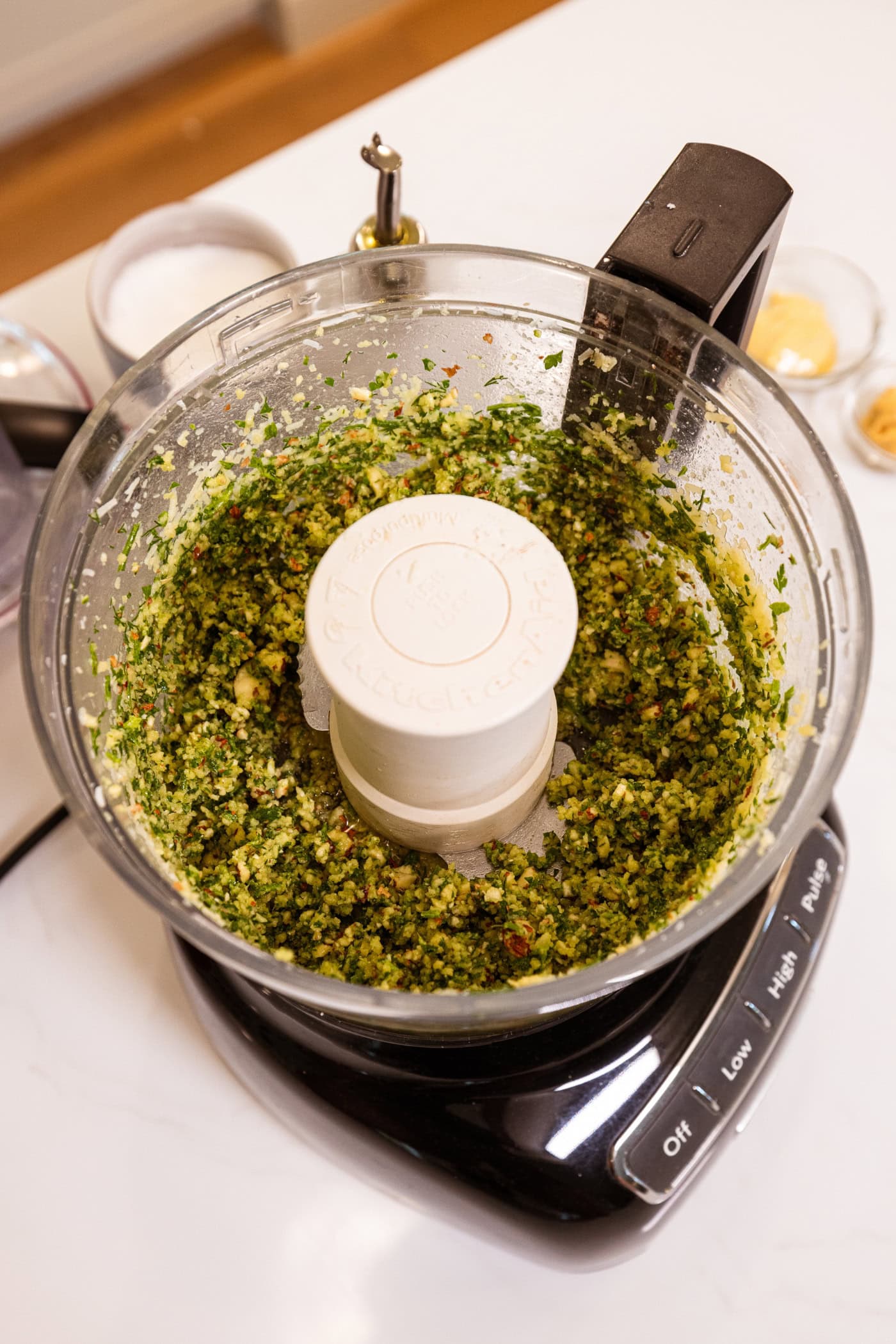 Herb crust for fish recipe mixed together to form a pesto-like mixture in a food processor.