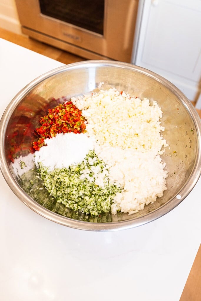 Diced vegetables sit in a bowl.