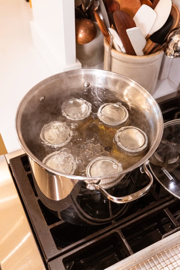 Jars sit in a water bath.