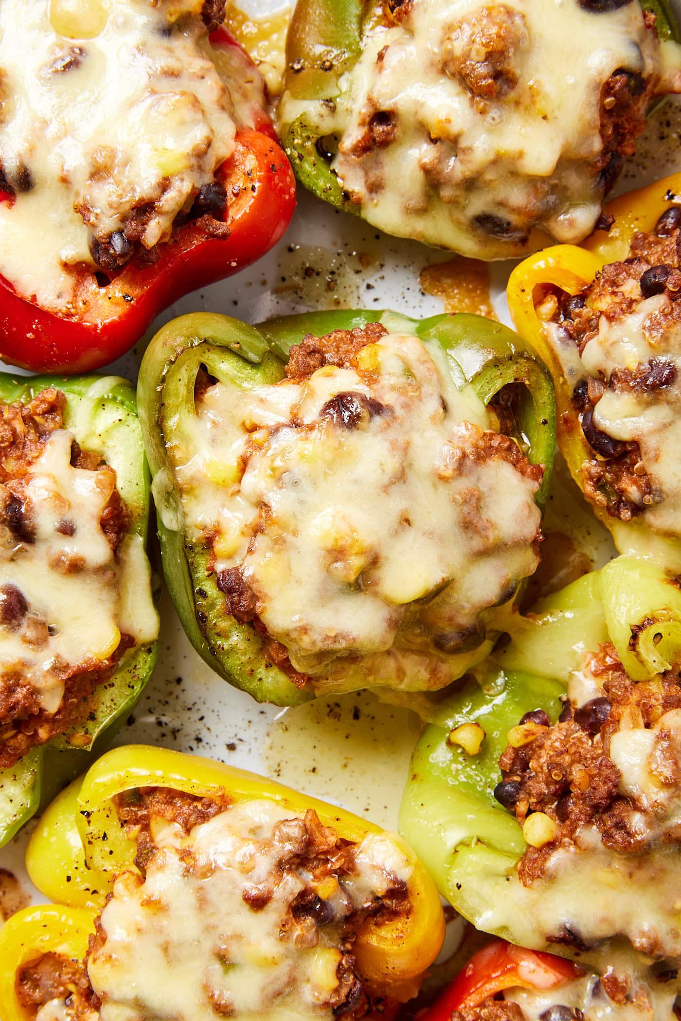Melted cheese over a stuffed bell pepper.