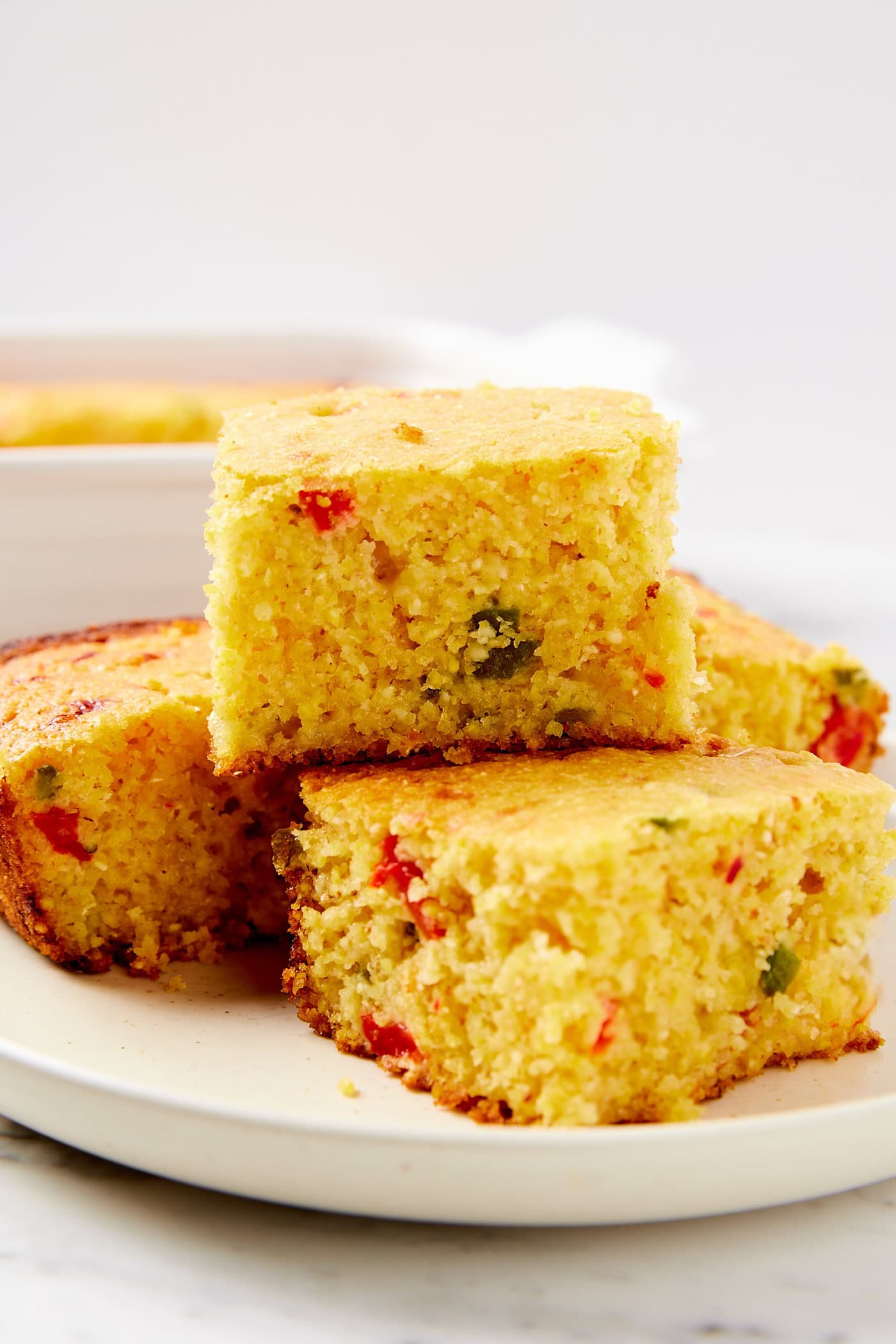 Side profile of piece of jalapeño cornbread stacked on top of each other.