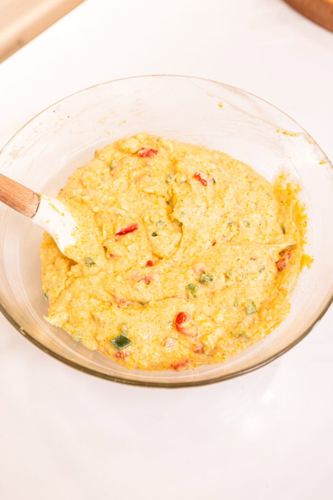 A finalized batter for brown butter jalapeno cornbread sits in a bowl.