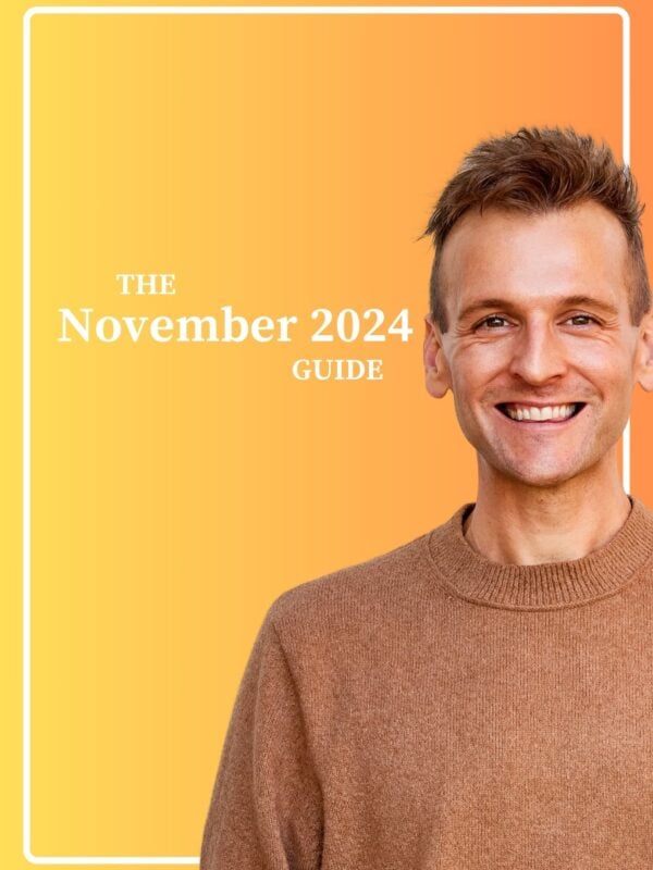 Kaleb Wyse wearing a brown sweater standing in front of orange background with the words "The November 2024 Guide".