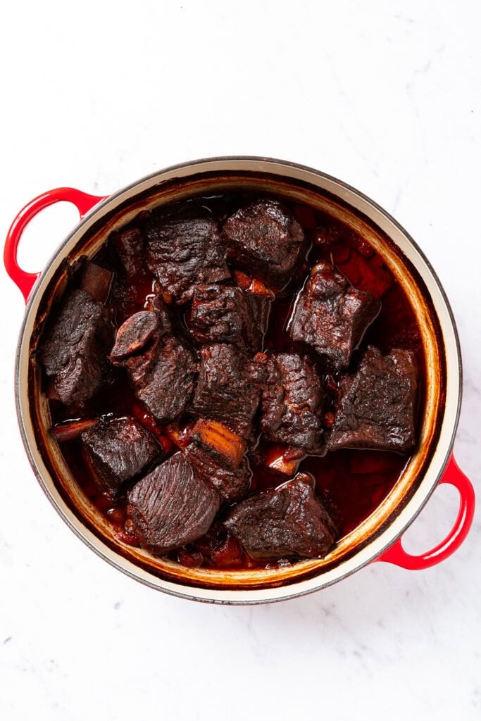 Short ribs in a Dutch oven after baking.