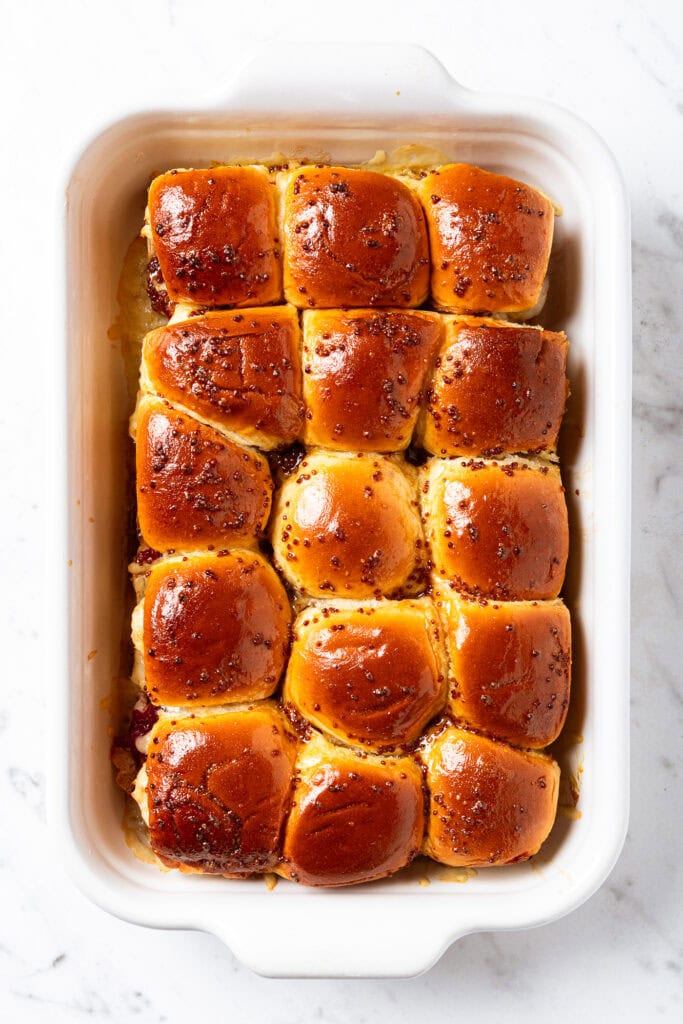 Holiday sliders in a baking dish after roasting.
