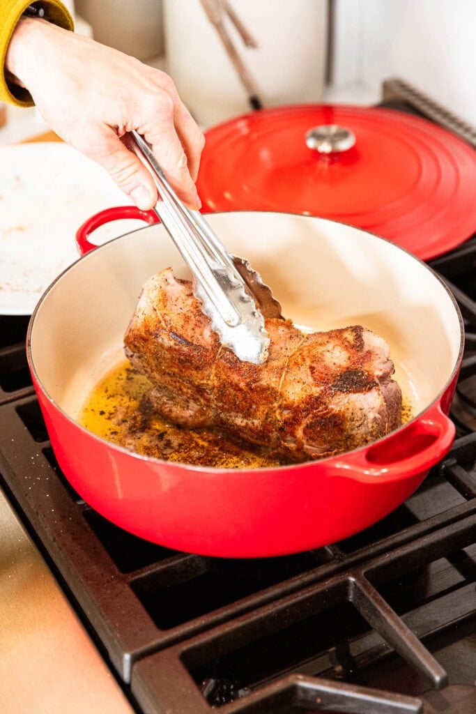 Browned pork roast on the stove.