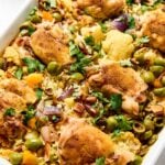 A baking dish full of chicken rice pilaf.