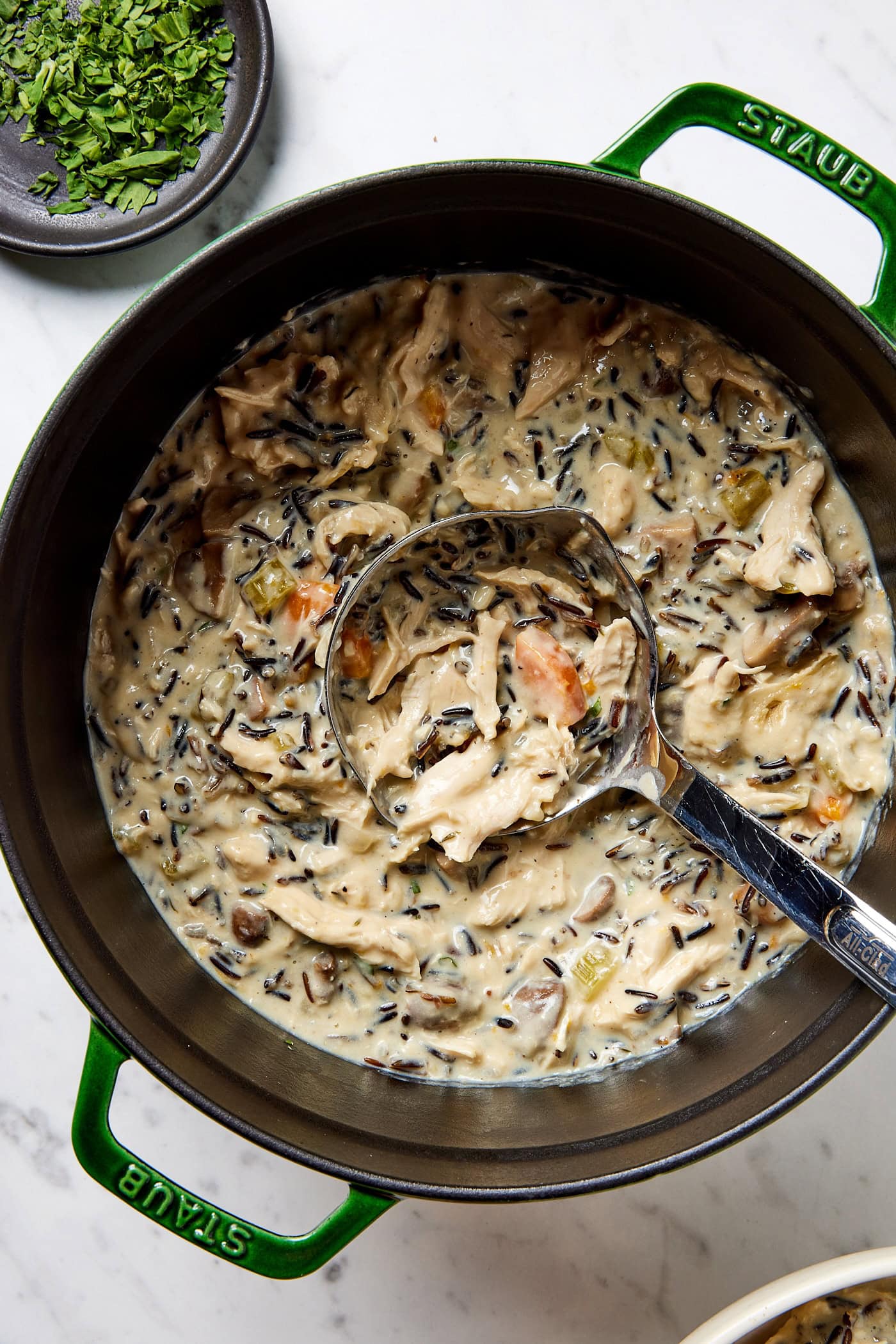 Chicken and wild rice soup in a pot.