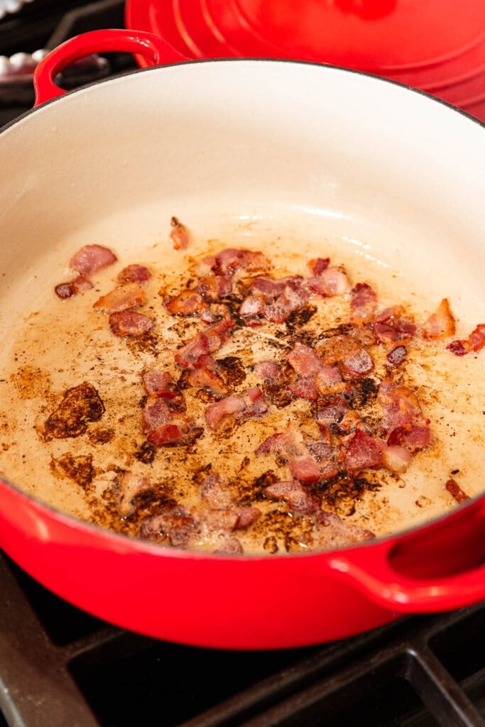 Bacon bits browned in a pot.
