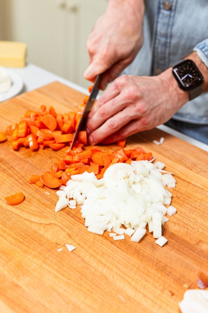 Dice the onion and carrot.