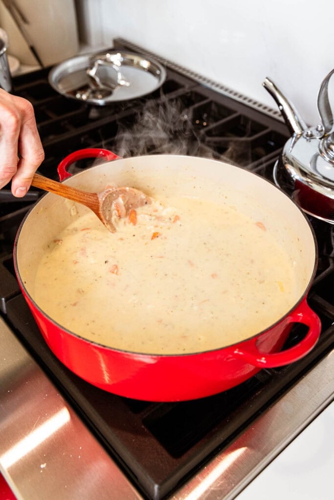 Chicken pot pie simmering in stock and cream.