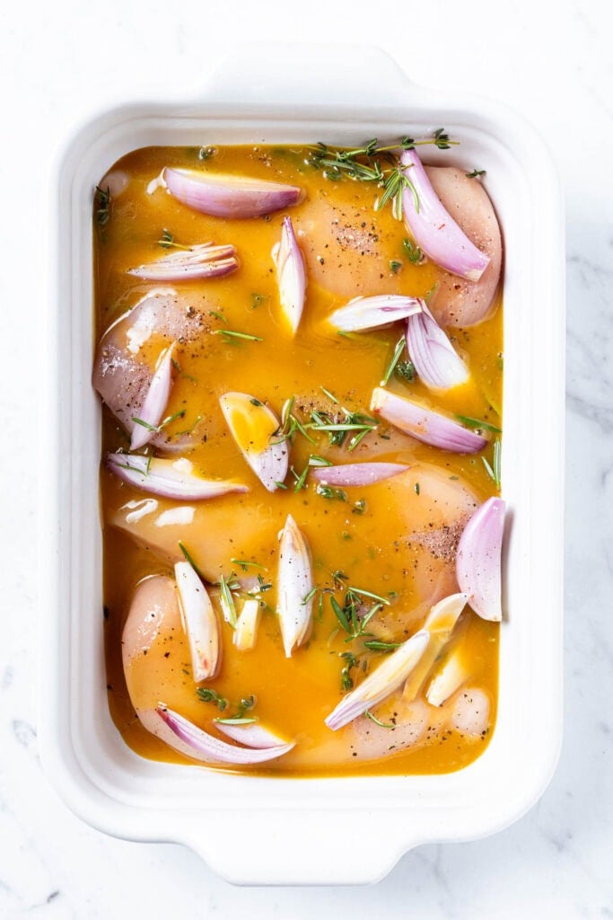 Chicken breast in a honey mustard marinade prior to baking.