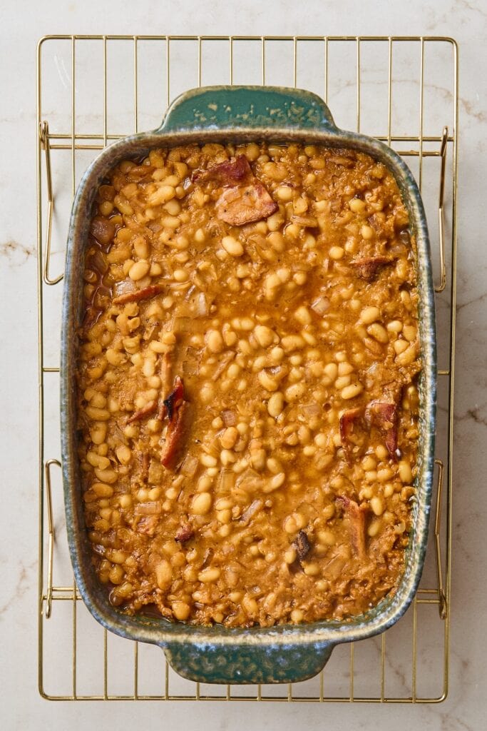 Baked beans in a casserole dish before being placed in the oven.