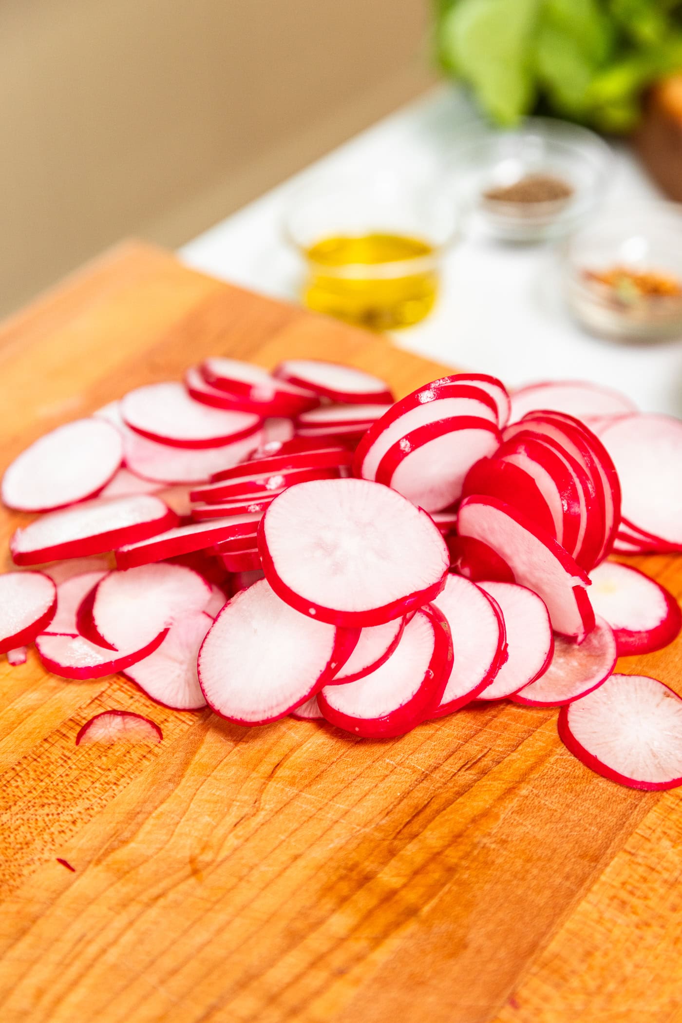 Sliced radish sits on a cutting board.