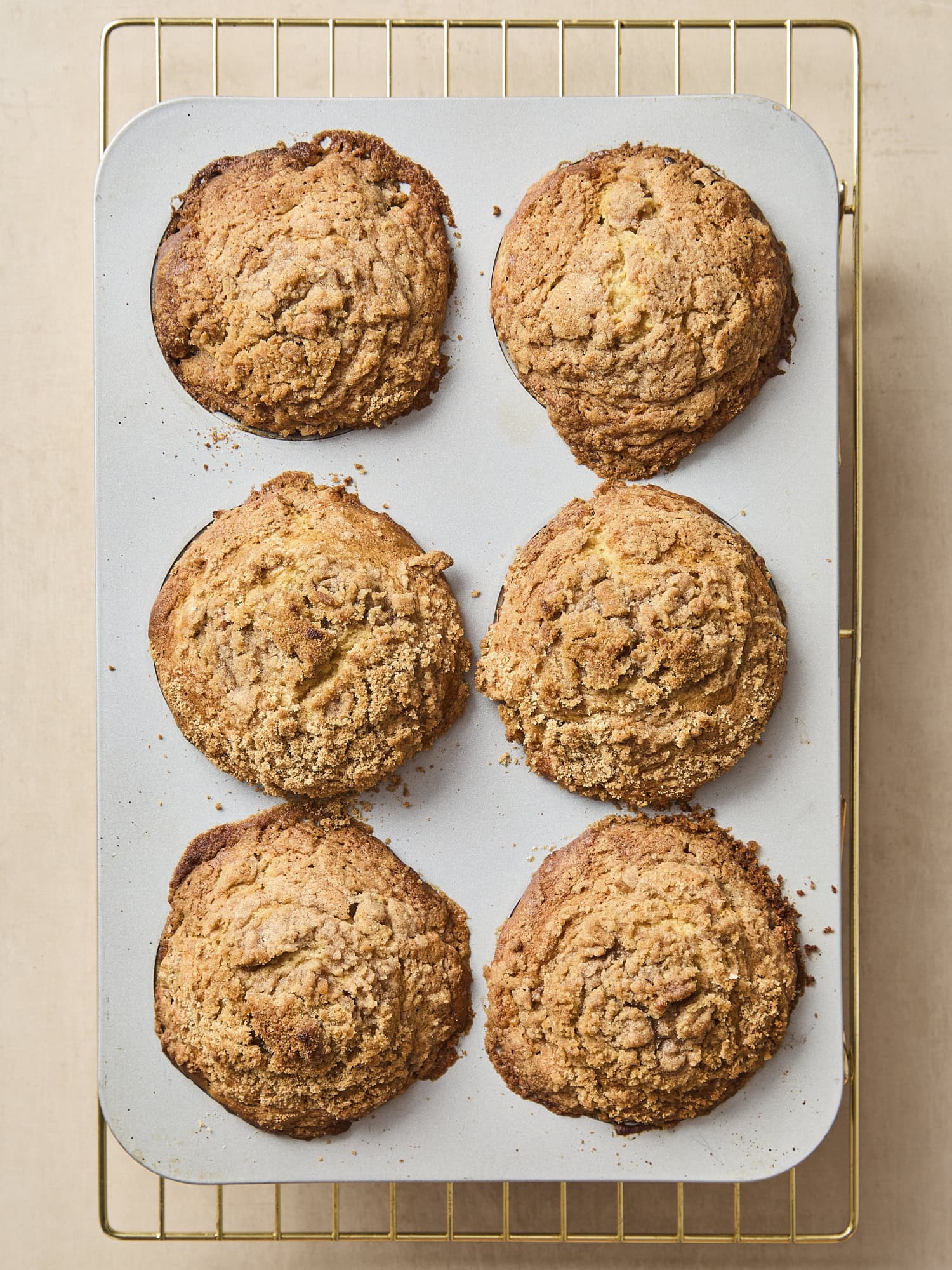 Baked rhubarb muffins in the baking pan.