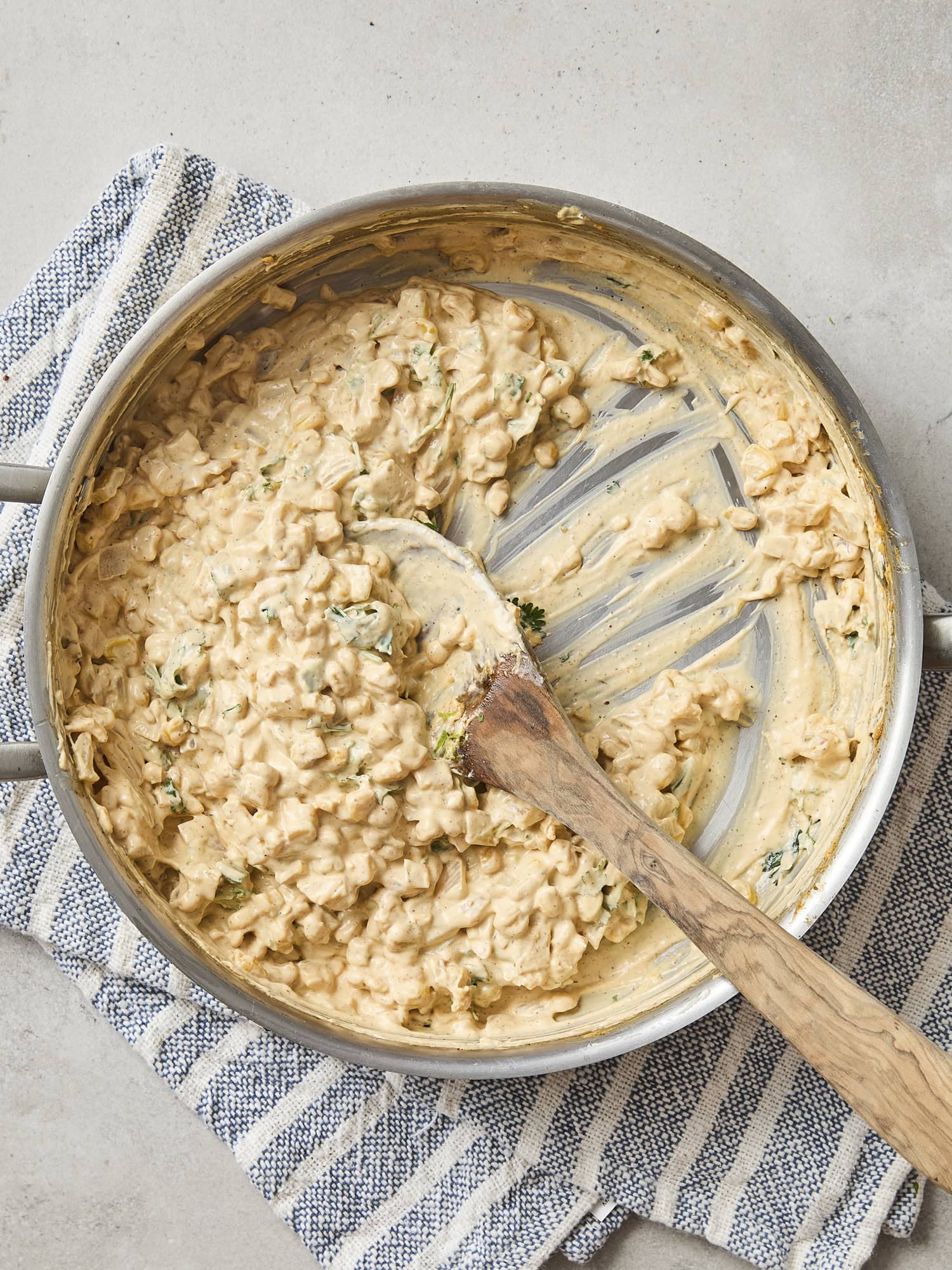 Saucepan with creamy corn dip after cooking.