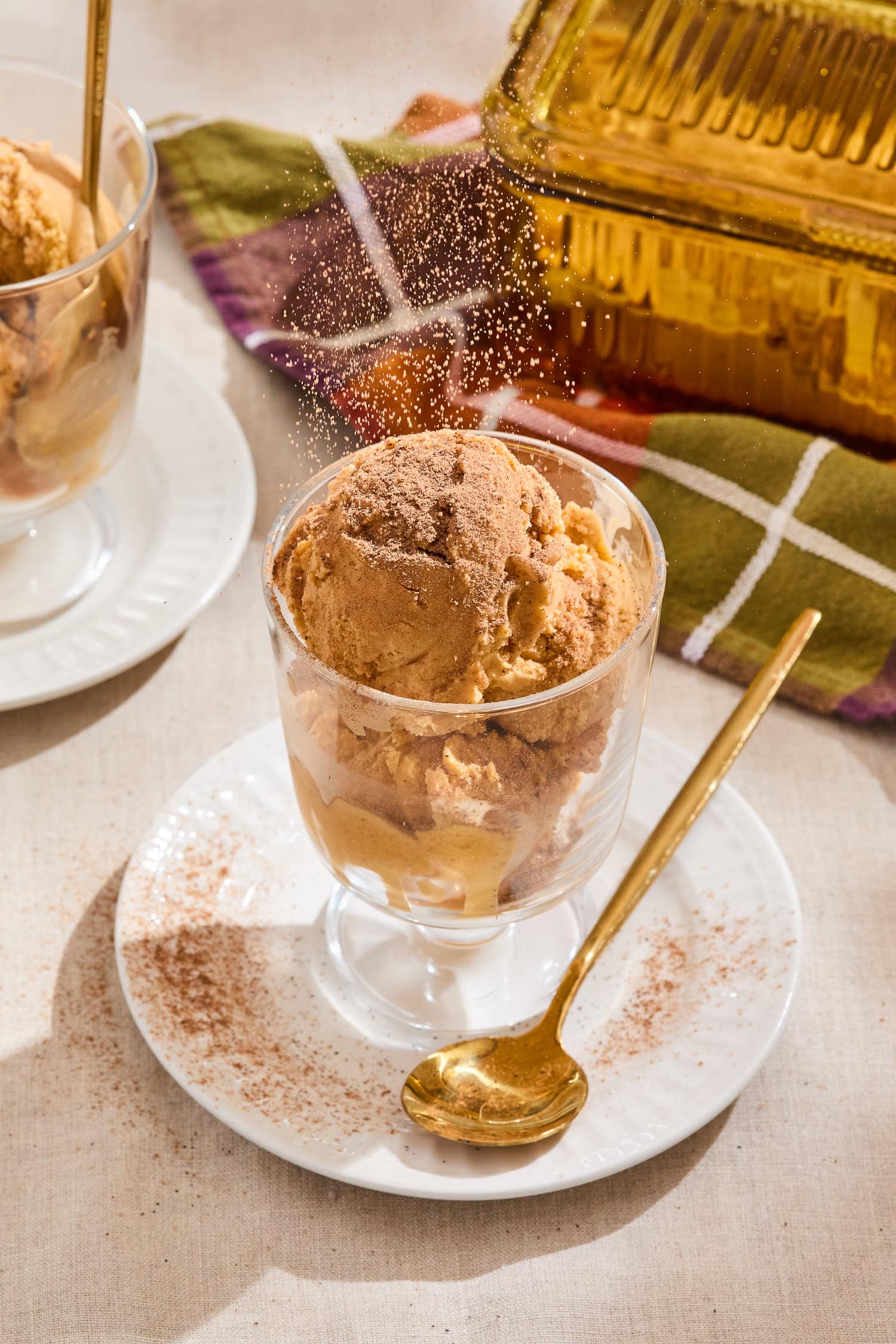 Pumpkin ice cream in a glass serving dish.