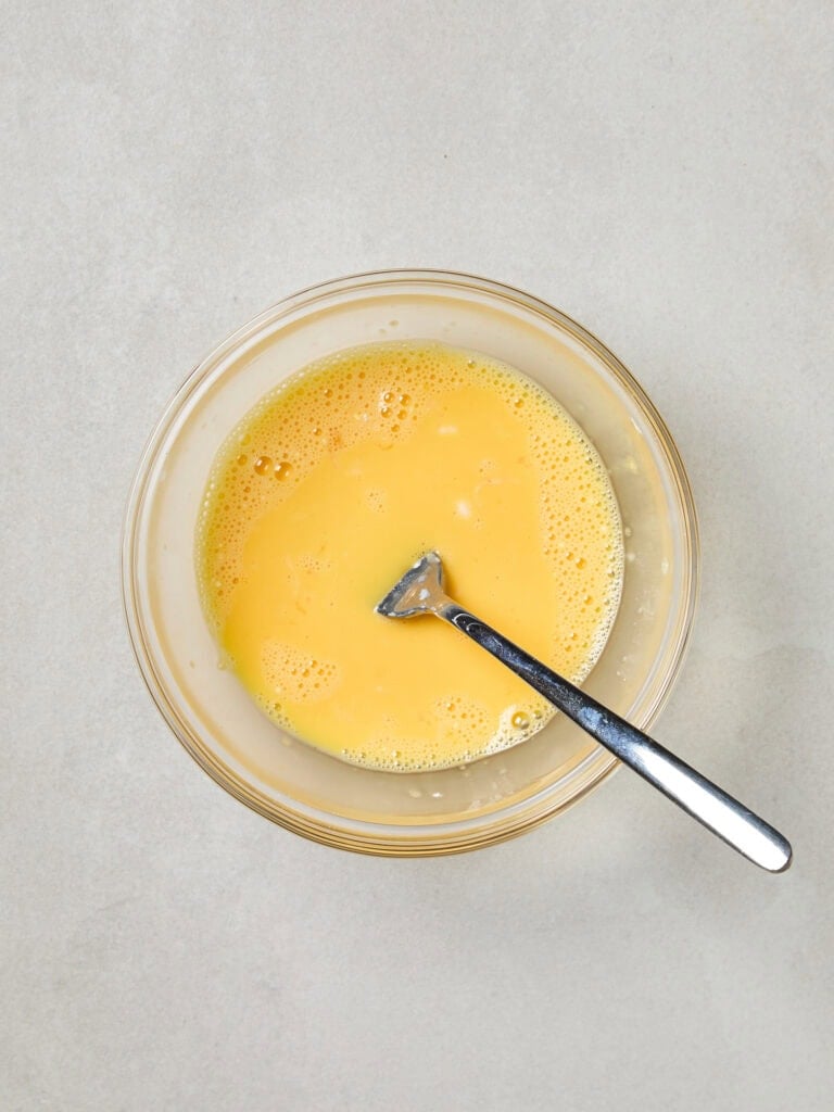 A bowl full of egg slurry mixture for ice cream.