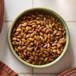 A small bowl filled with roasted pepitas.