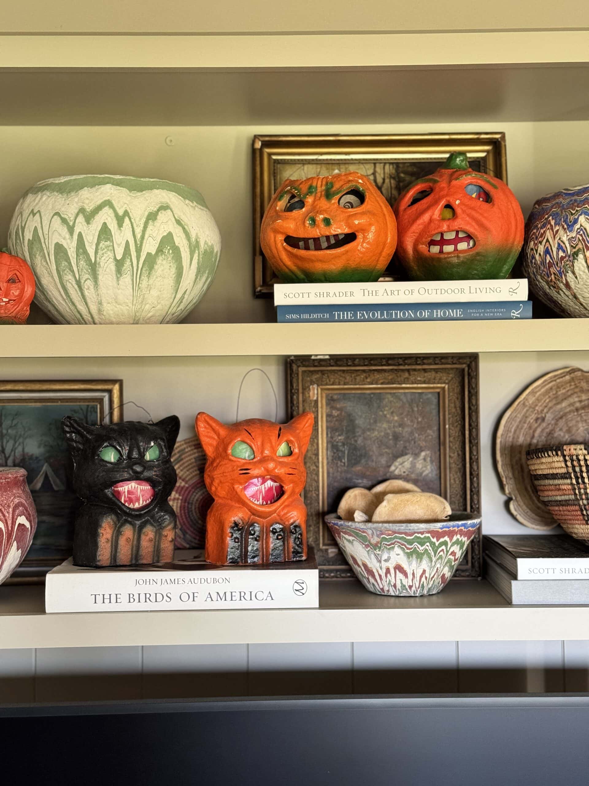 Halloween decor sitting on shelves.