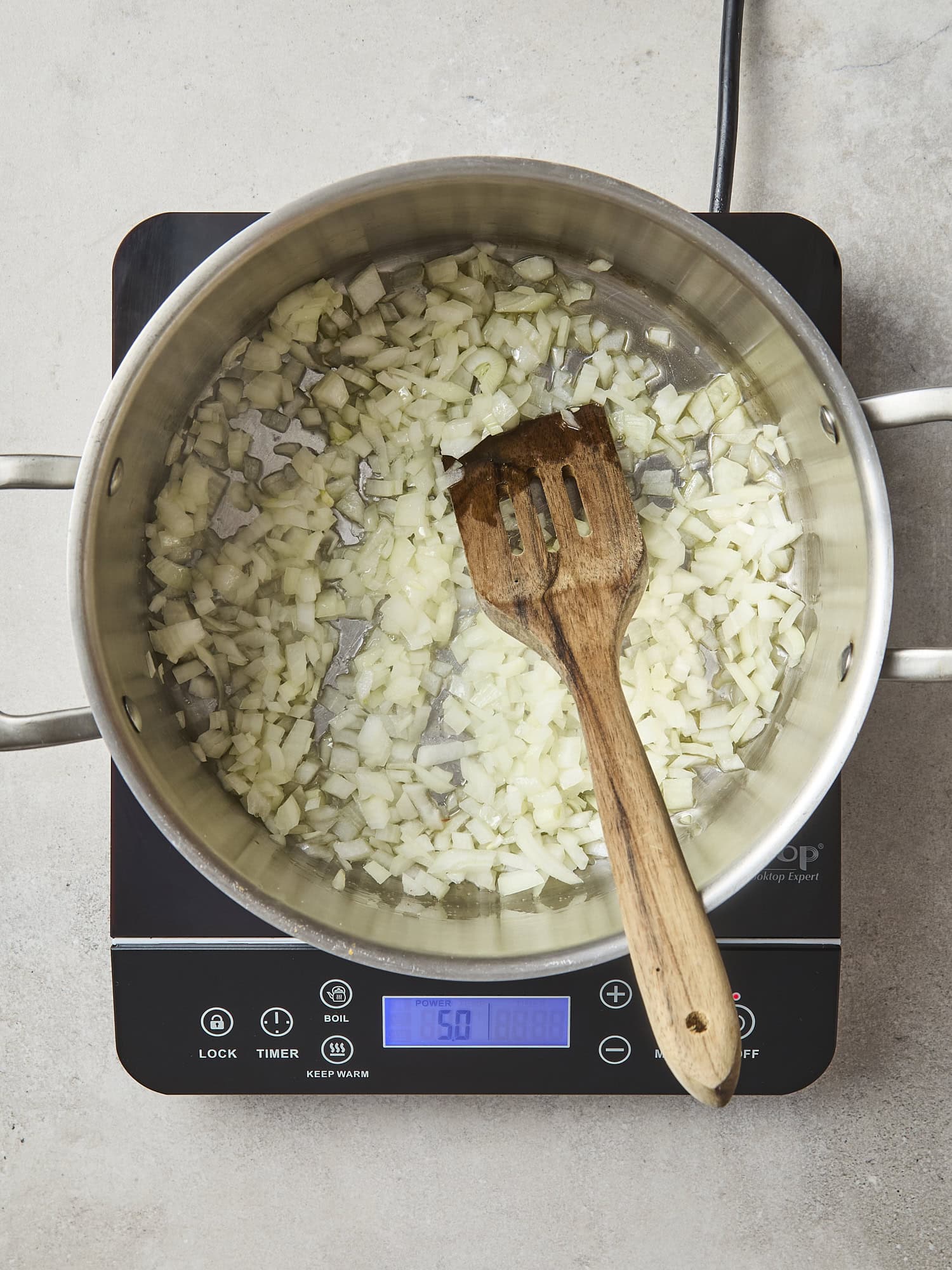 Onion sauteing in a pan for lasagna.