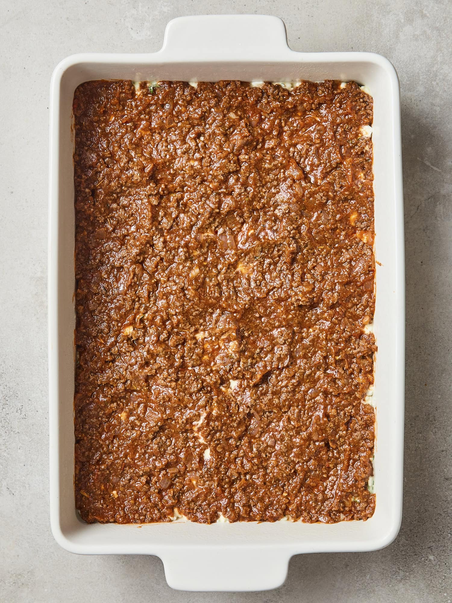 Meat sauce as a layer of lasagna.