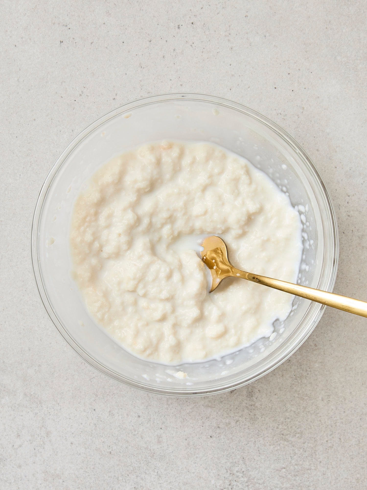Bread and whole milk mixture for creating meatballs.