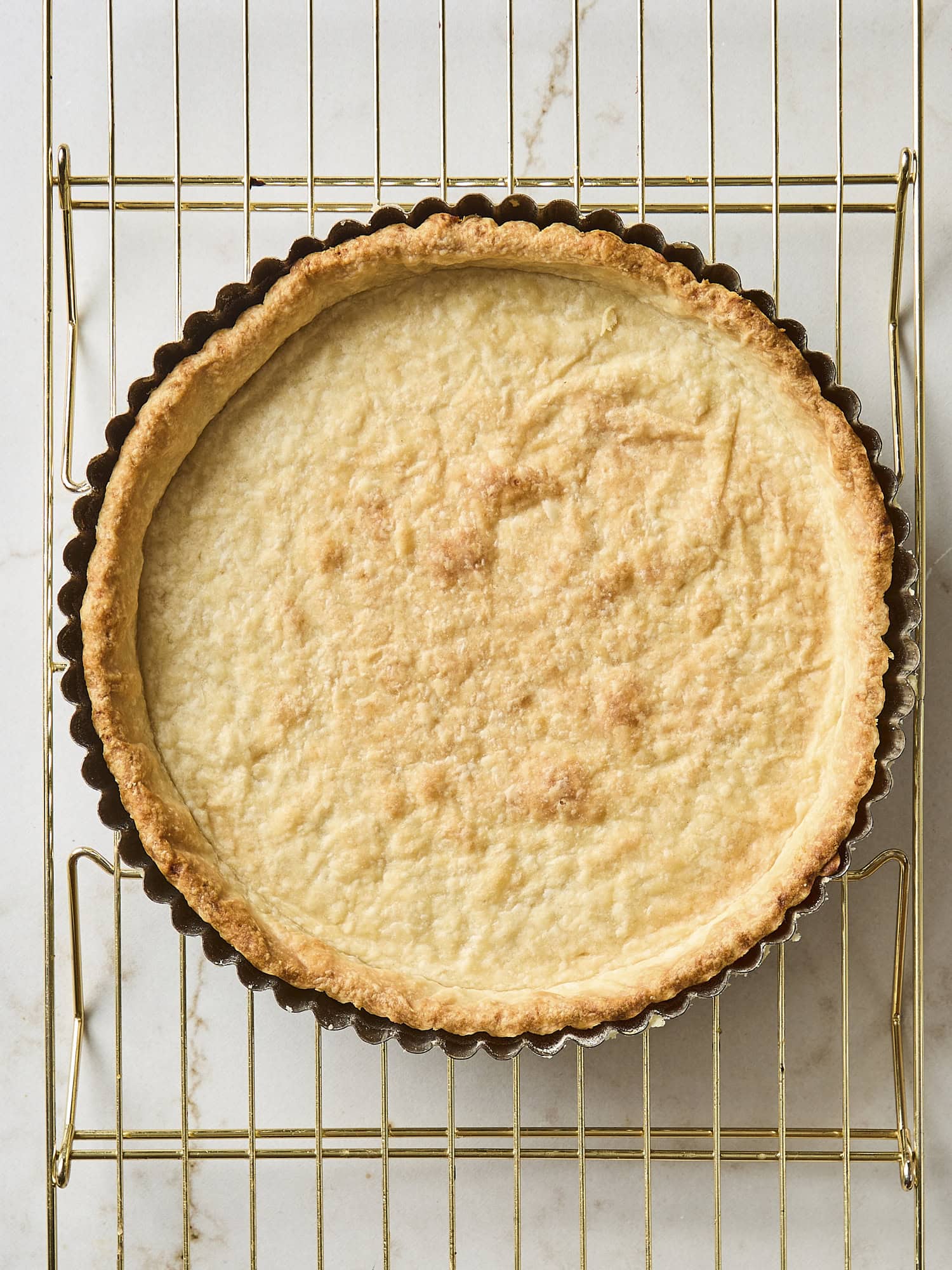 Baked dough in a tart shell for fruit tart.