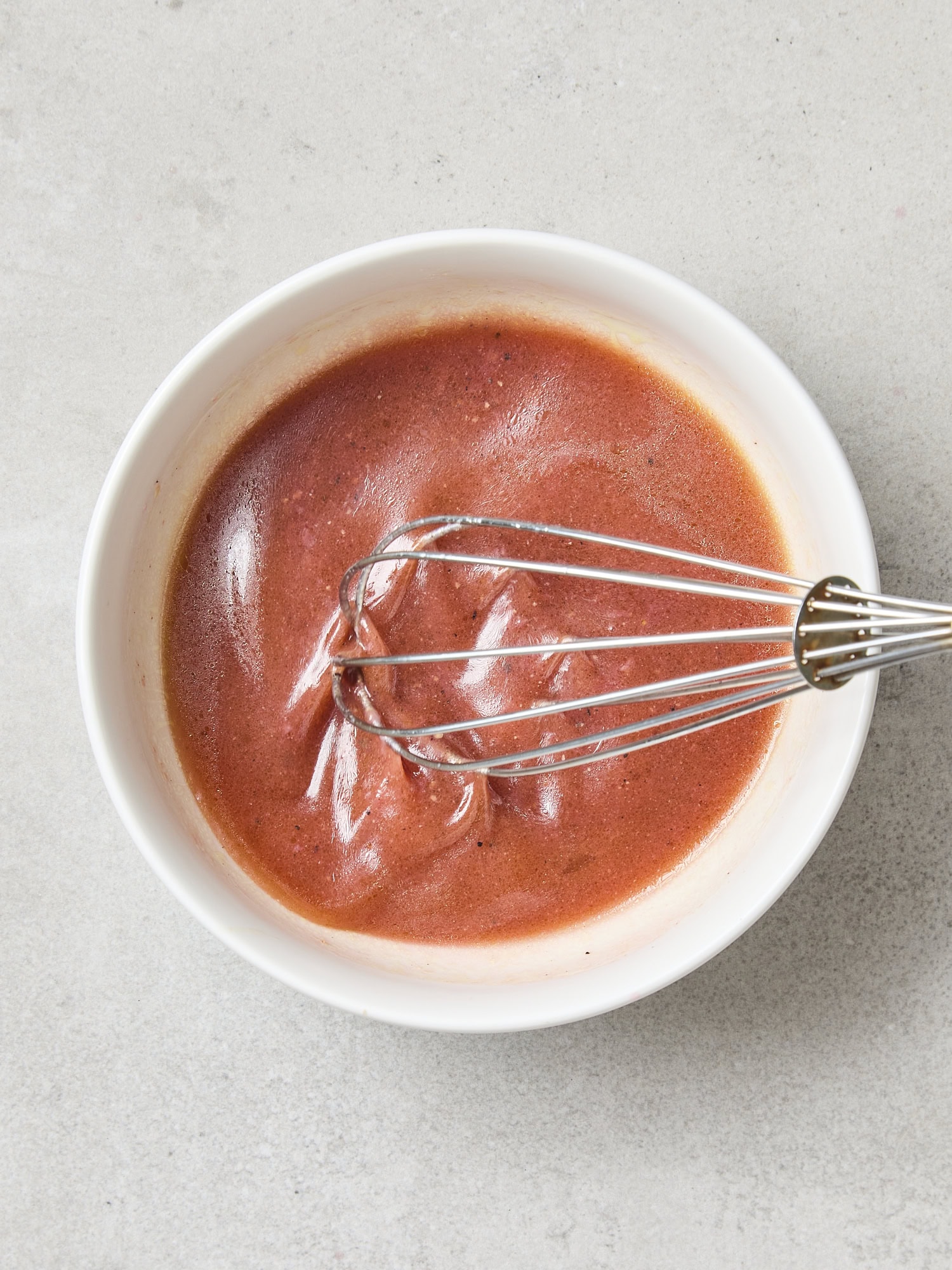 Whisking citrus dressing for farro salad.