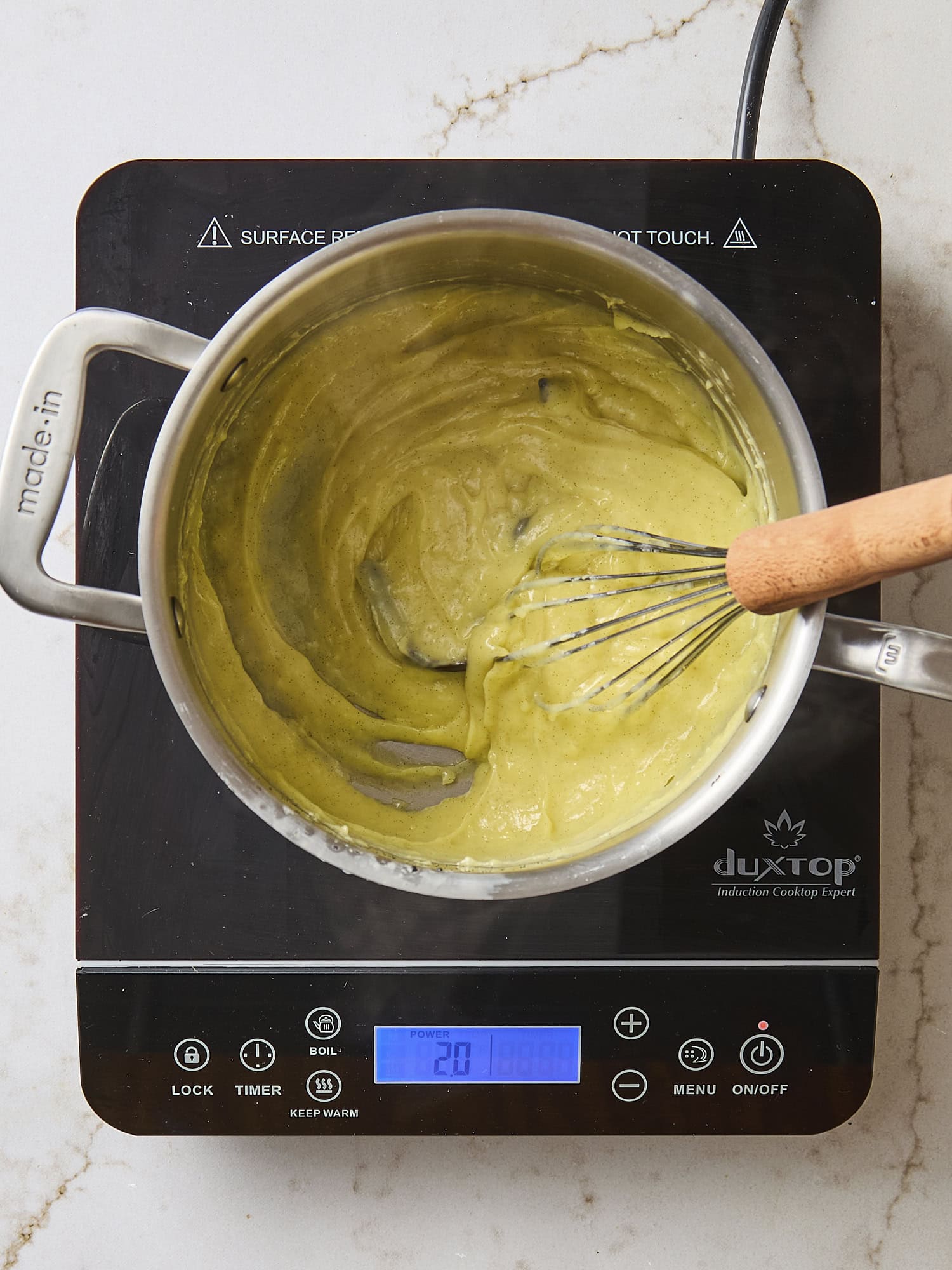 Cooked pastry cream mixture in saucepan.