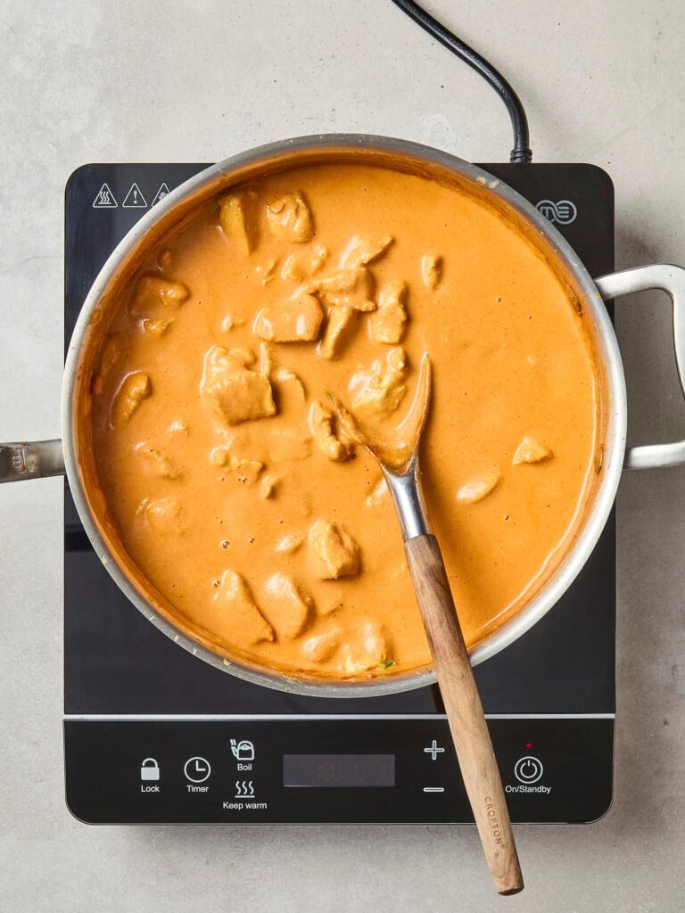 Butter chicken in saucepan after simmering.