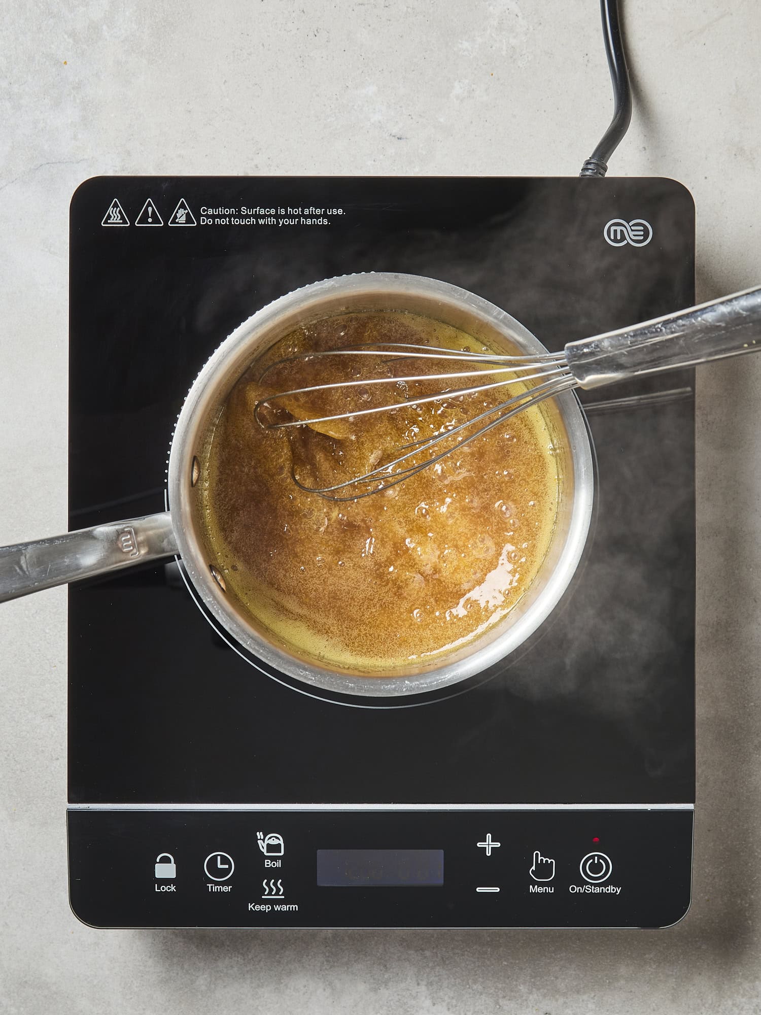 Glaze cooking in a saucepan.