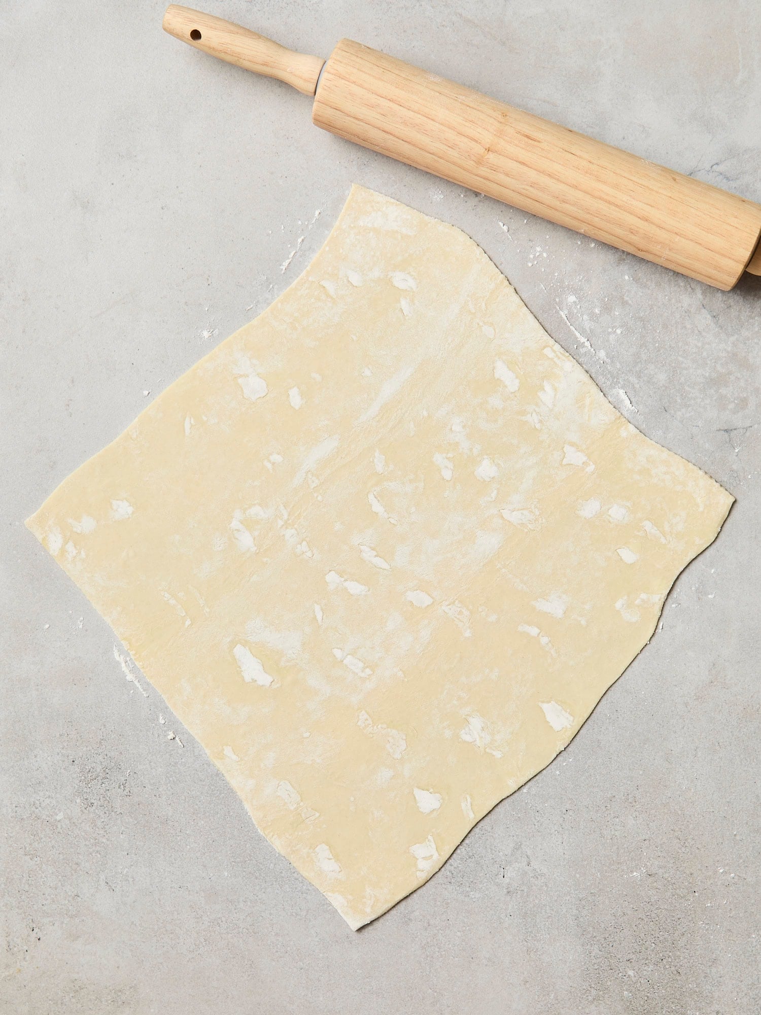 Rolled out puff pastry for quiche.