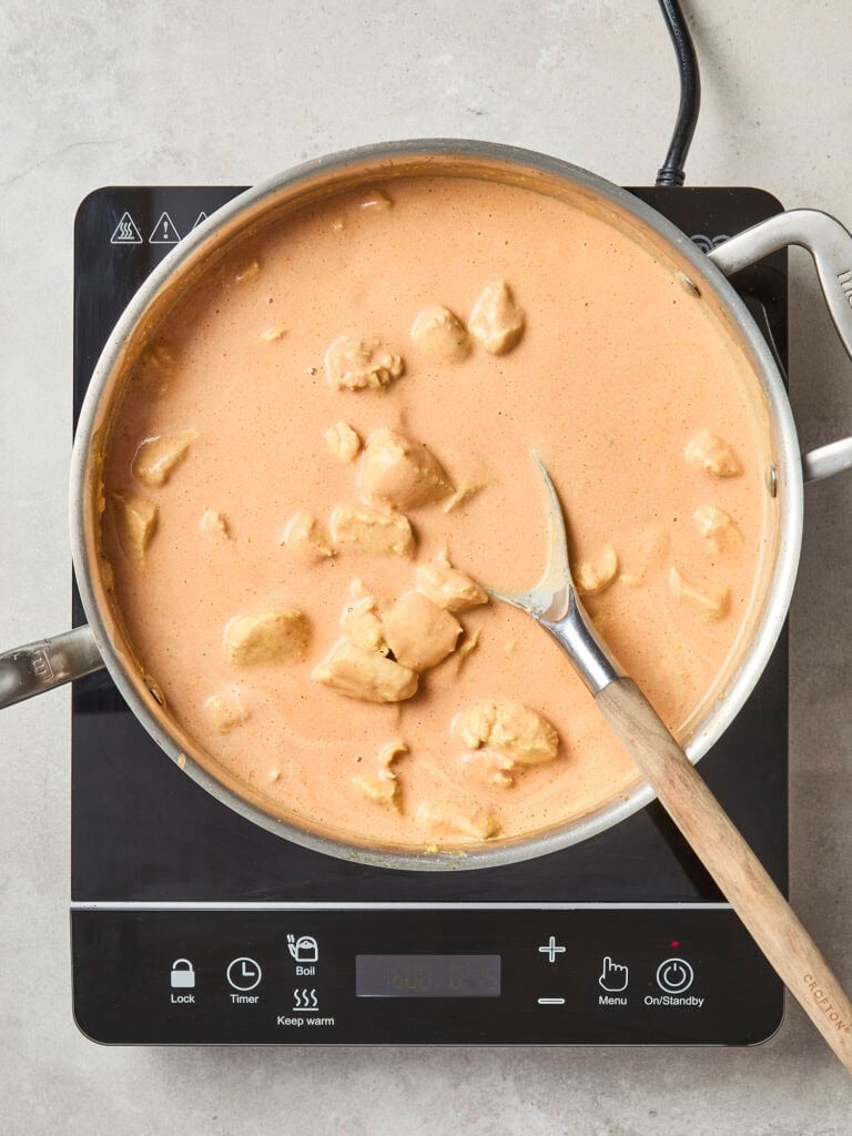Chicken in saucepan before simmering.