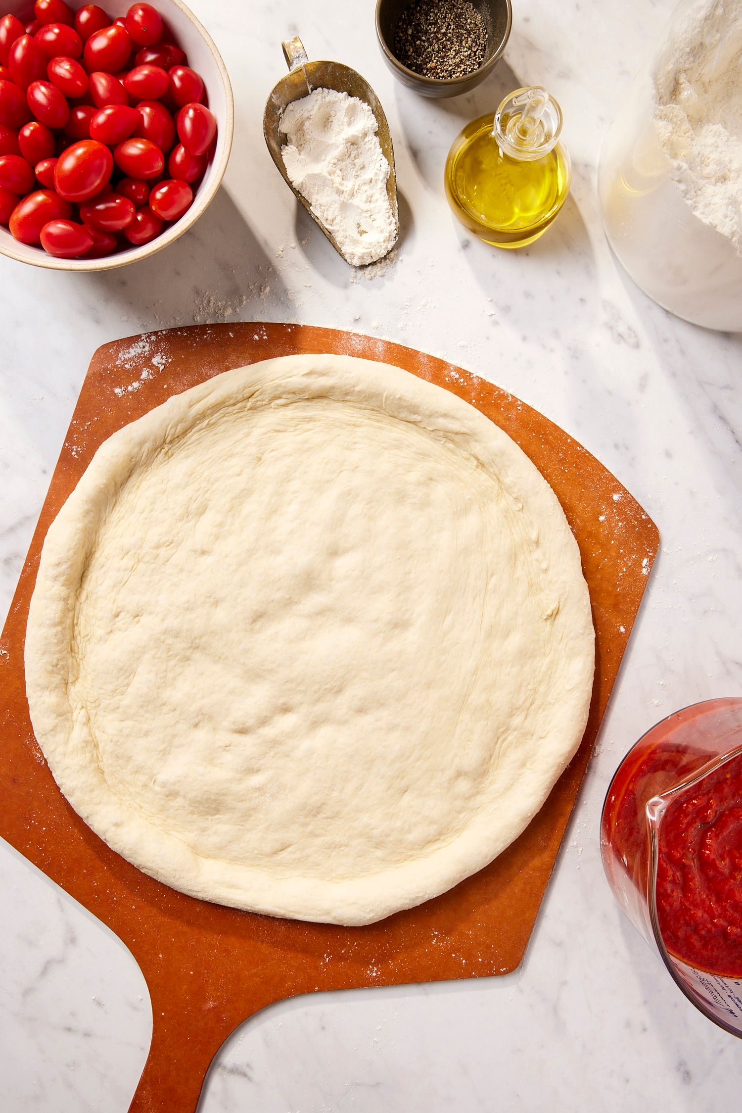 Pressed out easy pizza dough on board.