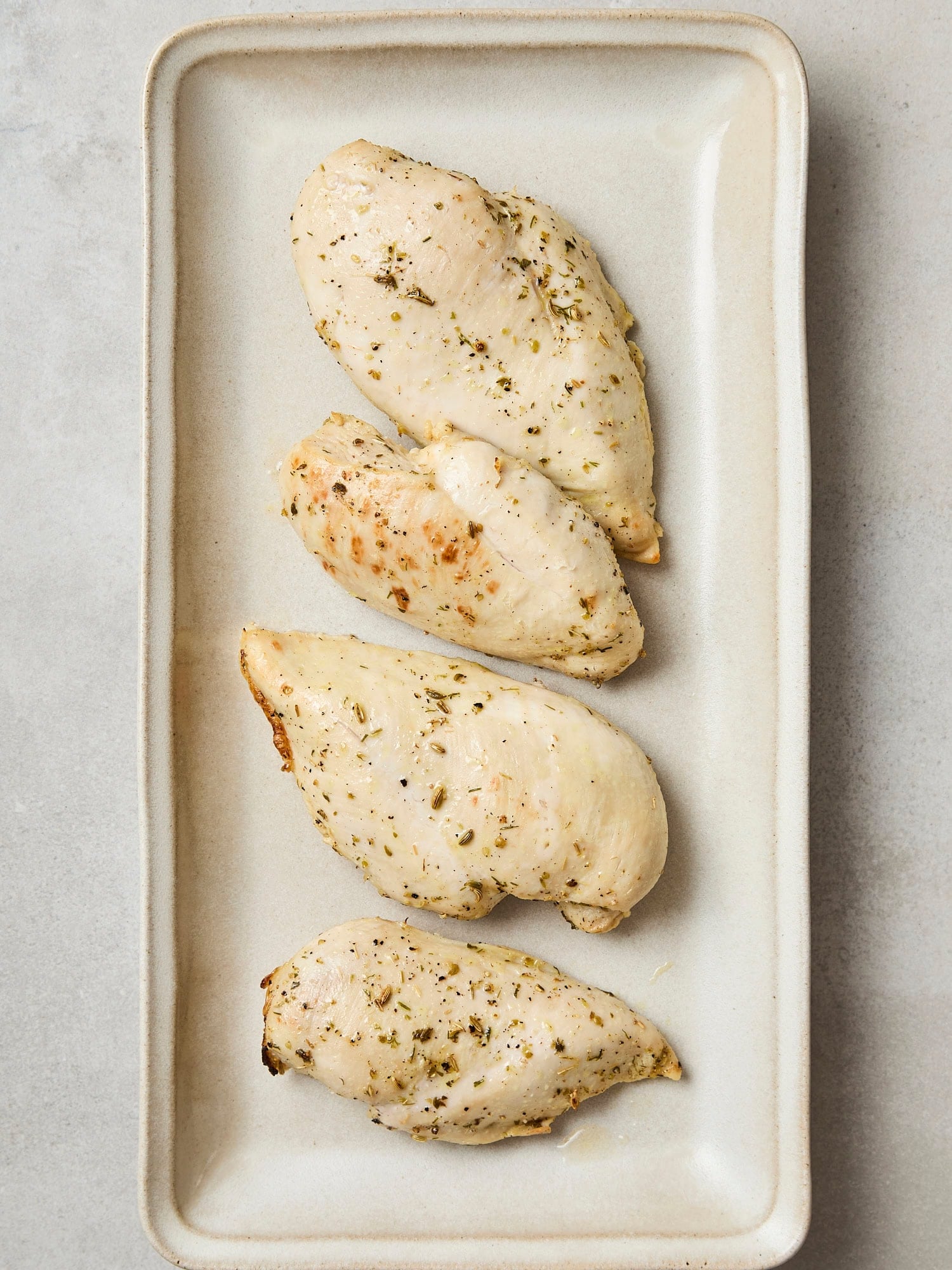 Baked chicken breast after coming out of the oven.
