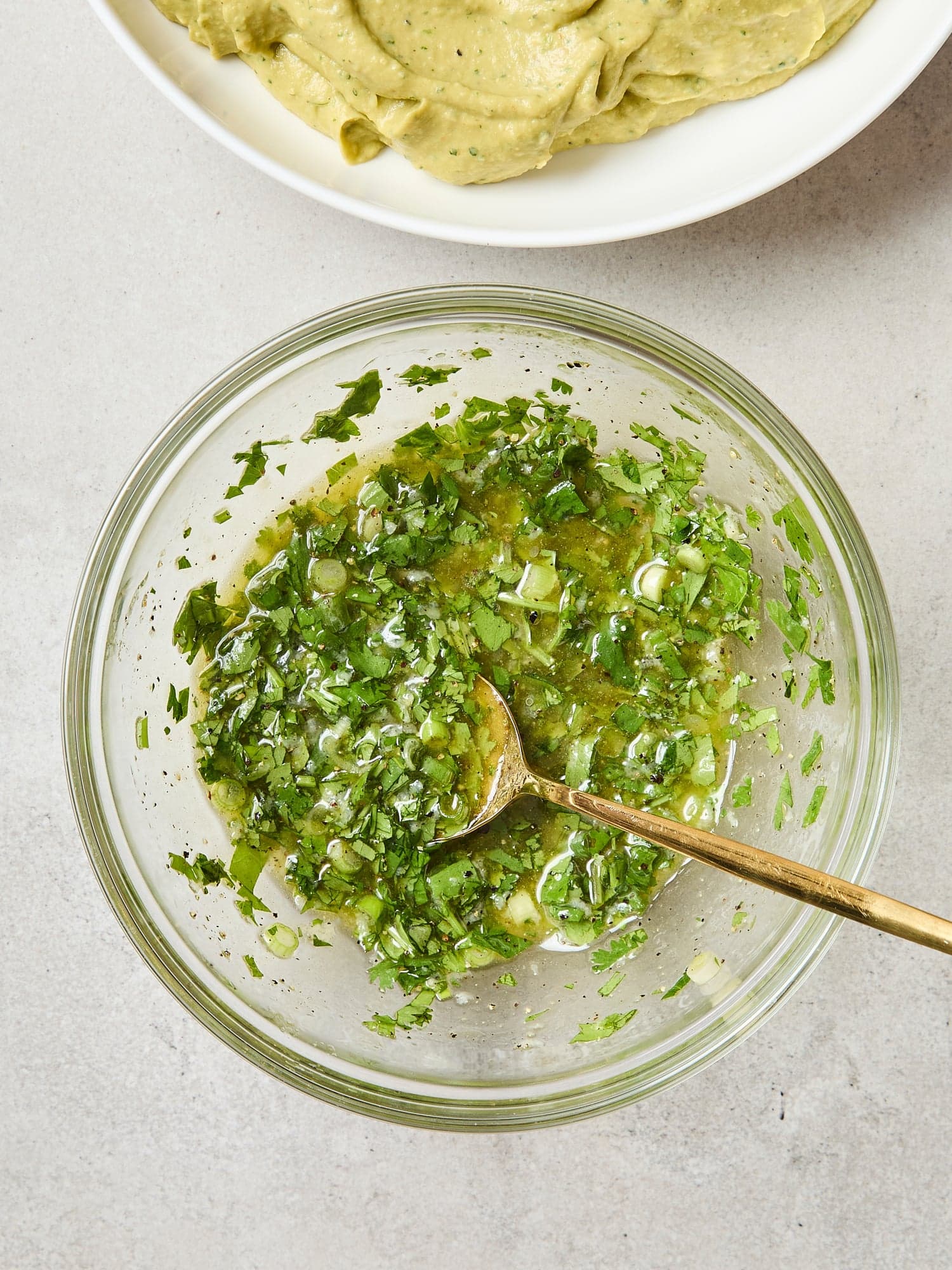 Cilantro sauce with a glass bowl.