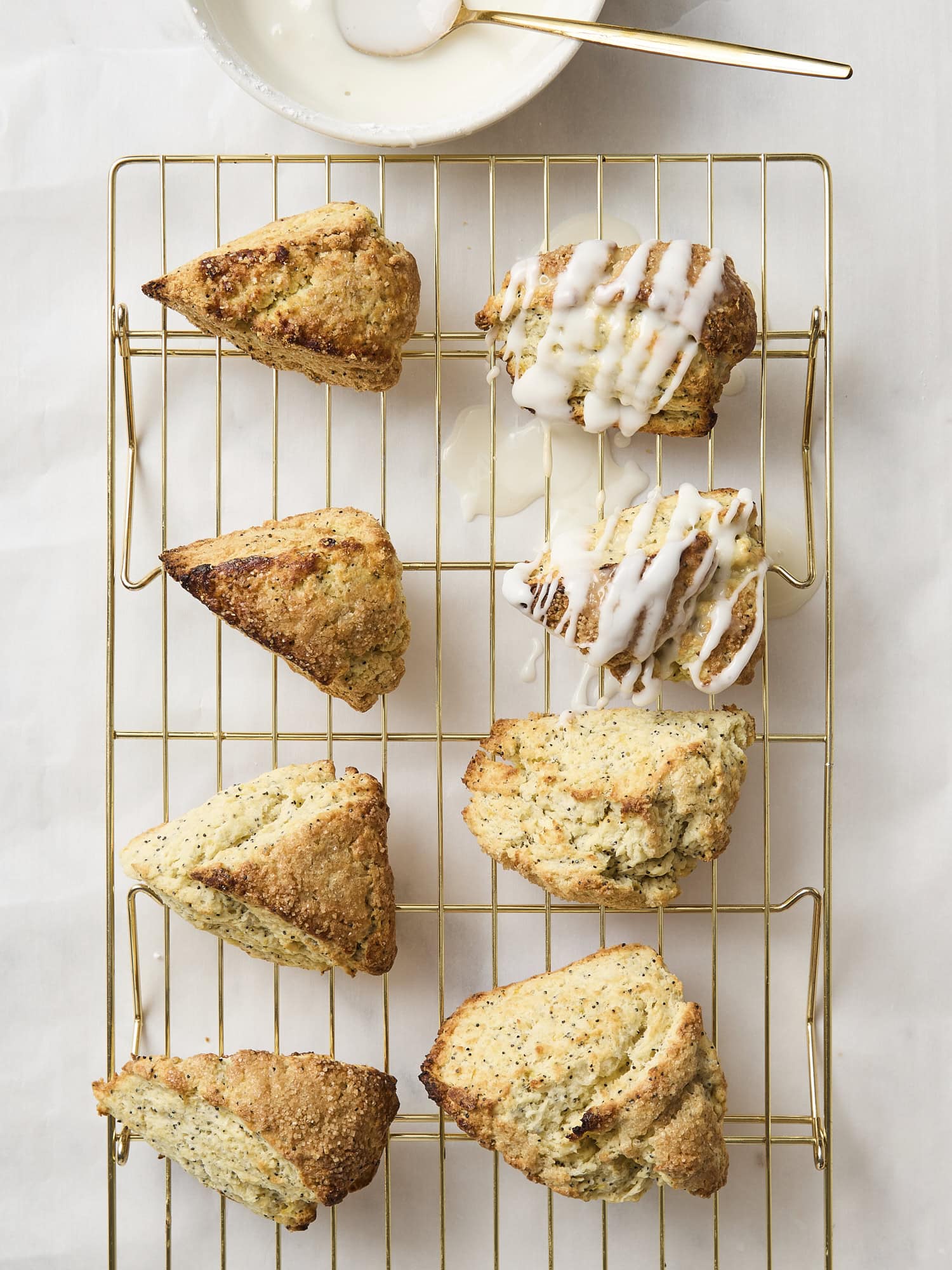 Baked scones with lemon glaze drizzled on top.