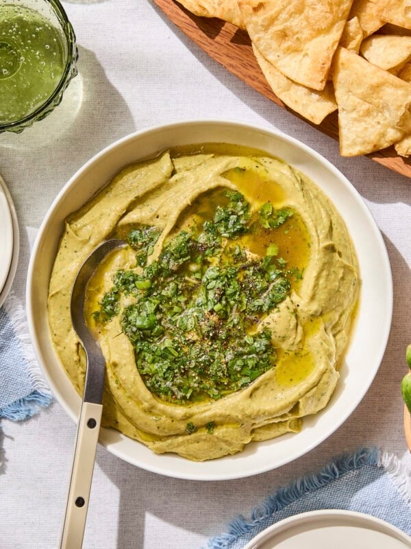 Avocado hummus topped with cilantro sauce.